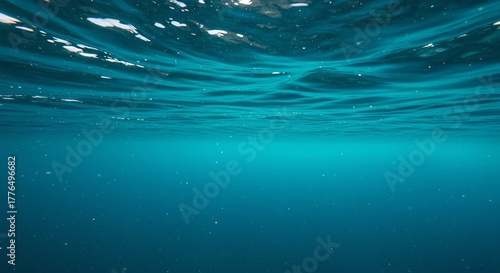 Fototapeta Naklejka Na Ścianę i Meble -  Underwater view of ocean surface and blue water