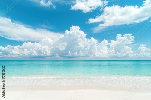 Peaceful tropical beach with white sand and turquoise sea under bright blue sky filled with fluffy cumulus clouds, ideal for travel promotions, resort websites, and summer background designs