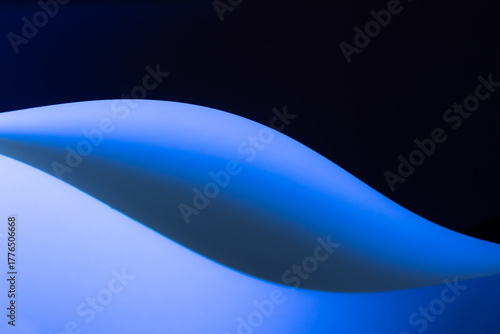 Abstract background showing curved lines creating dynamic shapes and shadows