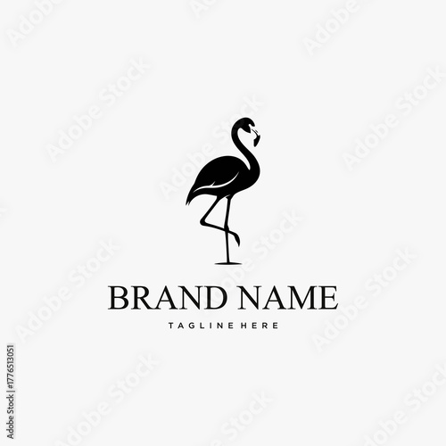 Elegant Black Flamingo Logo Design Standing on One Leg.