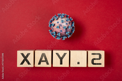 coronavirus and variant XAY.2 variant on a red background