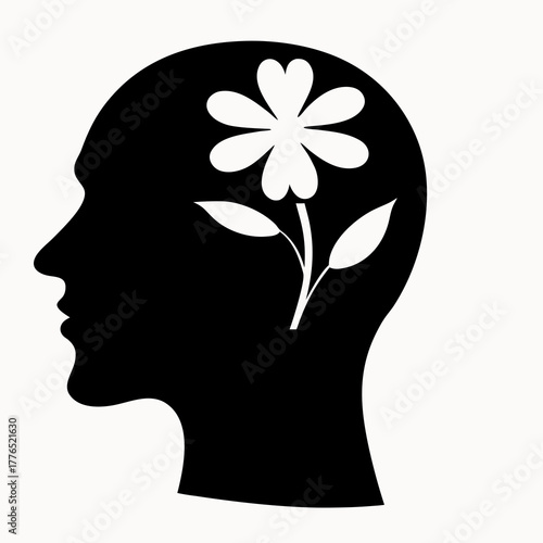 Silhouette of a head with a flower growing inside, representing growth and mental health, in black and white