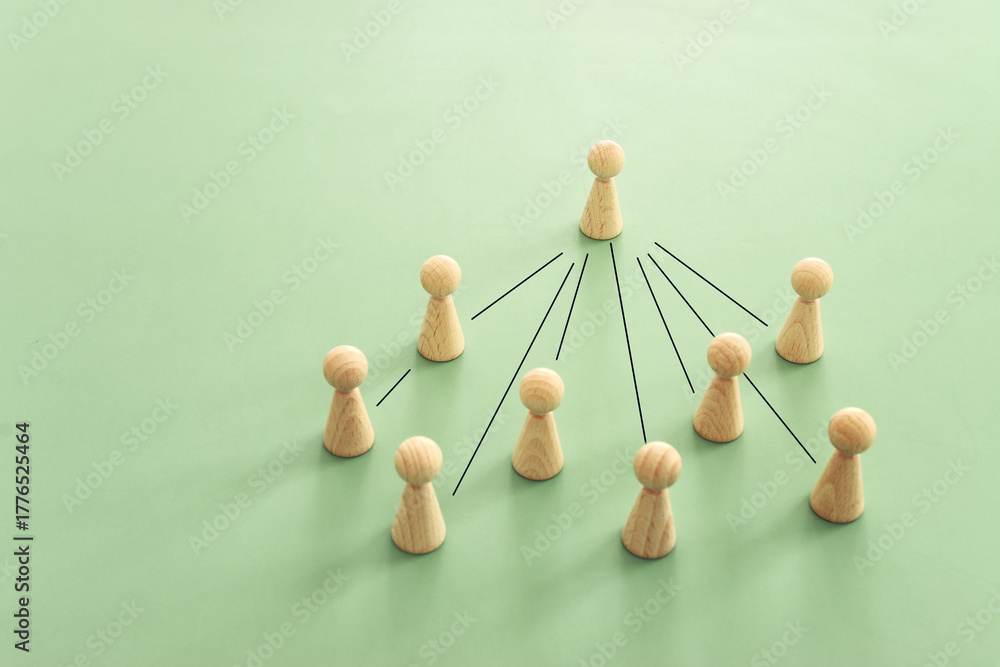Obraz premium Wooden figures and cubes with connecting lines. Idea of collaboration and teamwork