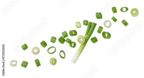 Fototapeta Naklejka Na Ścianę i Meble -  Flying chopped scallion rings, fresh green onion isolated background