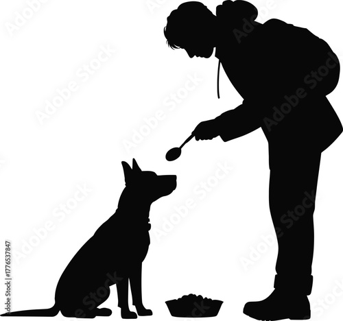 Silhouette of person feeding a dog from a spoon woman