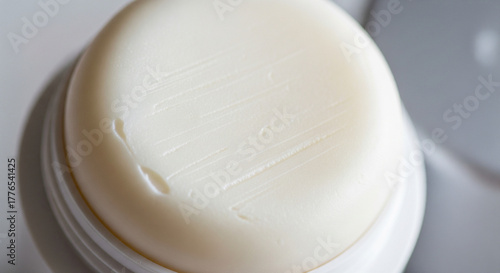 Macro Close-Up of Solid White Deodorant Stick Surface Texture
An extreme close-up, high-angle macro photograph focusing on the rounded, creamy white surface of a solid stick deodorant or antiperspiran