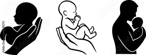 Silhouette of a baby held in a hand and a father holding a baby