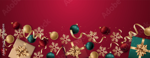 Festive arrangement of gifts and ornaments on rich red backdrop for celebrations. Web banner.