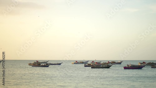 fishing boats at sunset