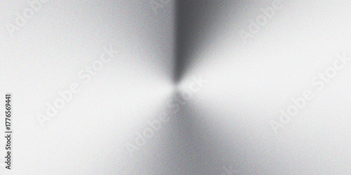 Brushed metallic steel texture background with smooth gradient light reflection and radial shine pattern, abstract industrial metal surface design