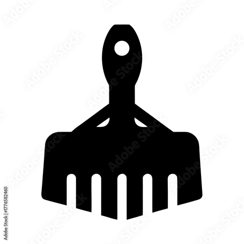 Black silhouette of a hair pick comb