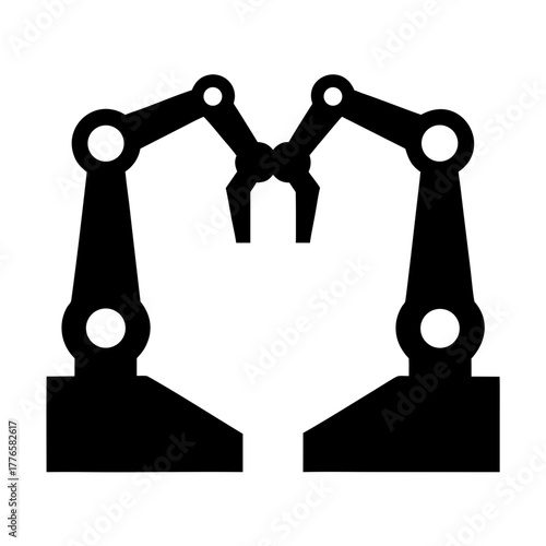 Industrial robotic arms in silhouette