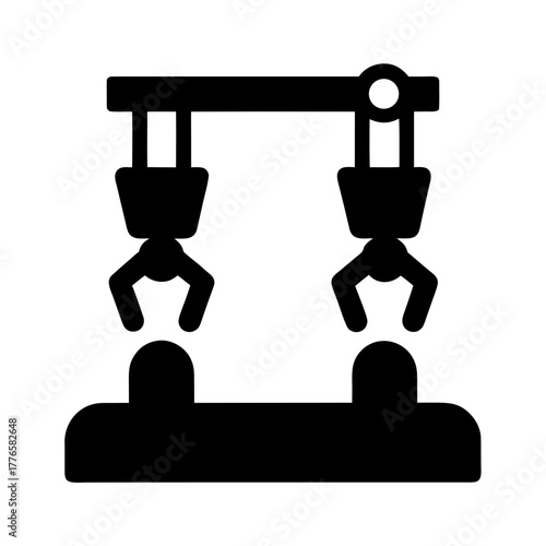 Industrial robotic arms in silhouette