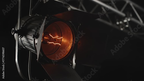 Cinematic Reveal A Dramatic Pan to an Igniting Studio Spotlight. studio film.