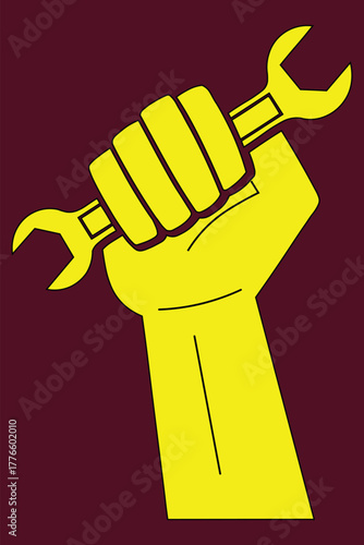 A stylized yellow fist tightly grips a wrench, symbolizing labor, strength, and industrial power against a dark background.