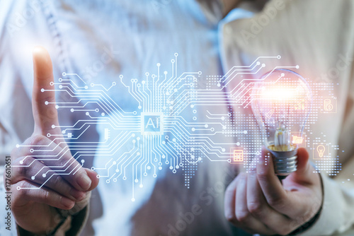 Person holding light bulb with digital AI circuit graphic while pointing, symbolizing innovation and technology in modern society