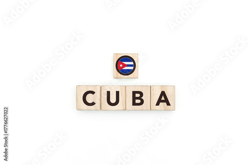 Wooden blocks bearing the name and flag of Cuba. Cuban and Caribbean Culture, national identity, travel, and geography in an advertising space design.