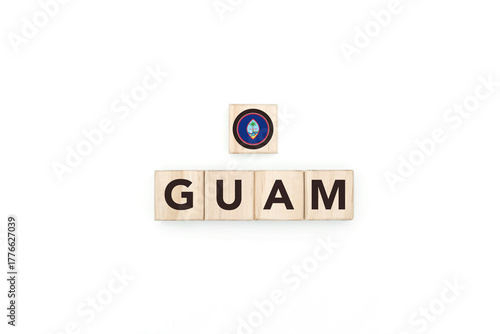 Wooden blocks bearing the name and flag of Guam. Guamanian and Micronesian Culture, national identity, travel, and geography in an advertising space design.
