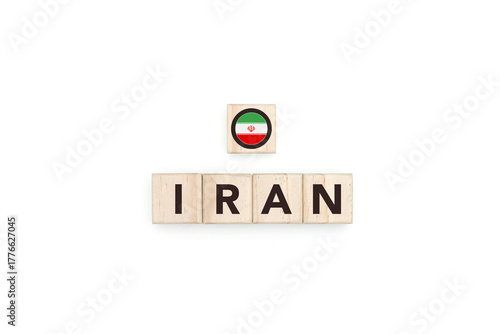 Wooden blocks bearing the name and flag of Iran. Iranian and Persian Culture, national identity, travel, and geography in an advertising space design.
