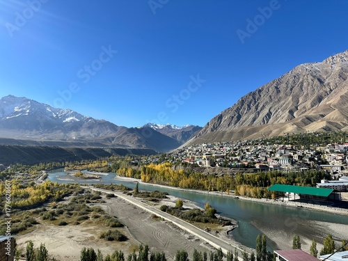 Photography Scenic View of Kargil, Ladakh with Winding River and Golden Trees in Fall