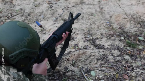 A soldier aims a rifle during a tactical training exercise. Concept for modern defense, disciplined focus, and security operations.