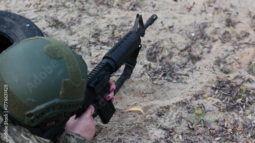 A soldier aims a rifle during a tactical training exercise. Concept for modern defense, disciplined focus, and security operations.