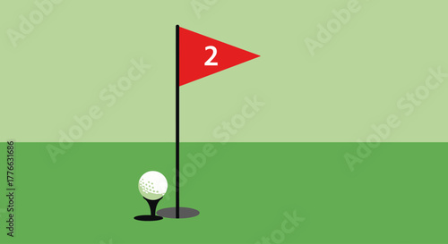 A golf ball rests on a tee next to a flag with the number 2 on it, marking a hole on a green golf course.