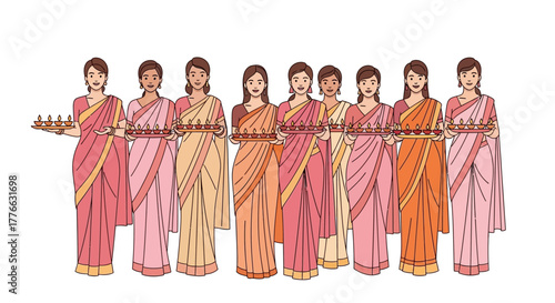 Group of women in saris holding trays of lights.