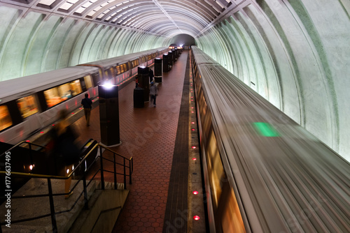 Washington D.C. - Subway station with passengers and train in motion blur	