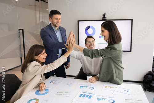 Group of happy young business project managers celebrating success