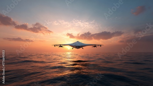 Unmanned aerial drone flying over ocean at sunset. High-tech aircraft for surveillance and future military technology or reconnaissance mission concept.