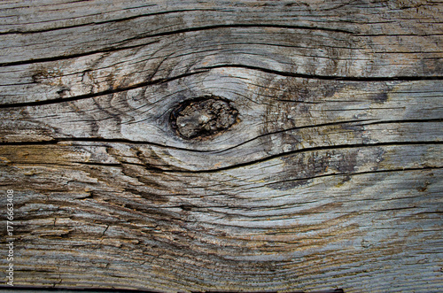 Surface of aged old wood, highlighting its unique grain patterns and rough texture illuminated by natural daylight. Wood appears rustic and timeless. Rustic style Dark brown wooden table