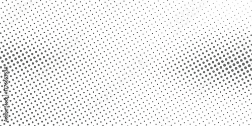 Halftone gray dots on white background with gradient effect pattern. Grunge halftone background.