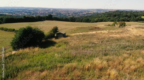 Farmland rugged countryside with cow shed in Dewsbury 