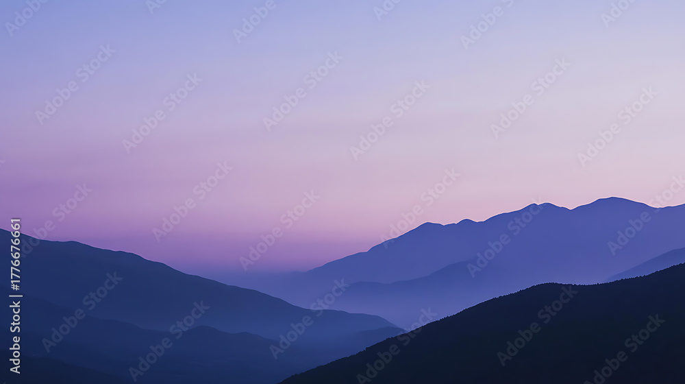 Fototapeta premium Serene mountain landscape at dusk, featuring layers of rolling hills in shades of violet and indigo under a soft, pastel-colored sky. Calming nature backdrop.