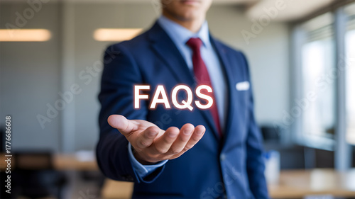 Businessman Holding Virtual FAQs Text: Frequently Asked Questions, Customer Support, Information Guide