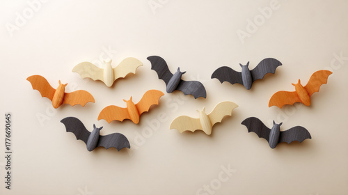 Halloween interior decor with paper bats gently fluttering on wall
