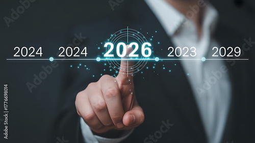Businessman pointing at the year 2026 on a futuristic timeline, representing business planning, forecasting, and strategic vision for the future
