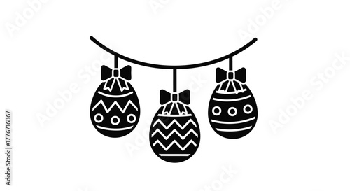 Black and white illustration of three decorated easter eggs Shapedecoration, festive banner hanging on a string