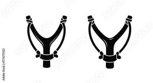 A classic Y-shaped wooden slingshot with rubber bands. 