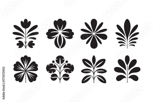 Collection of eight stylized black floral and leaf silhouettes