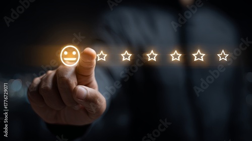 Hand Holding Digital Customer Review Interface with Five Stars Rating and Emoticon on Dark Background Reflecting Rating Importance and Online Feedback