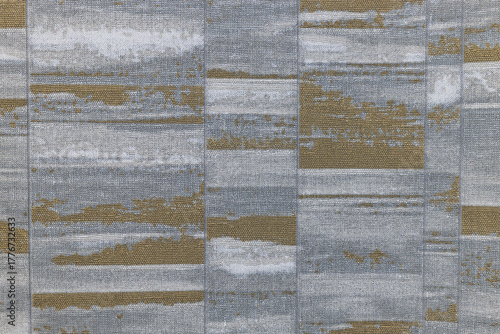 Silver and gold brushed metal rectangles forming a neutral geometric modern wall texture