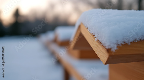 Wallpaper Mural Winter's touch: Fresh snow blankets wooden structures, creating a serene and peaceful scene.  Crisp lines and soft textures blend harmoniously under the gentle light. Torontodigital.ca