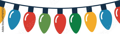 A string of colorful festive christmas lights in red green blue and yellow hanging against a white background