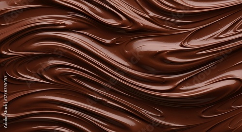 Indulge in luxurious melted dark chocolate swirls creating a rich, velvety, and decadent texture perfect for gourmet desserts and sweet treats.