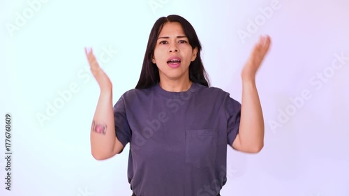 woman in blue shirt surprised, white background