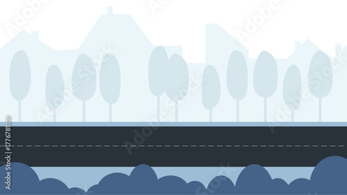 Cityscape of buildings, empty road and trees in a row, with bushes in the foreground