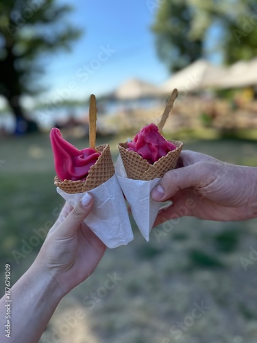 
Raspberry ice cream in hands