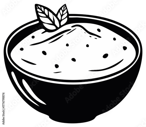 Bowl of creamy soup or porridge with mint garnish black and white icon
